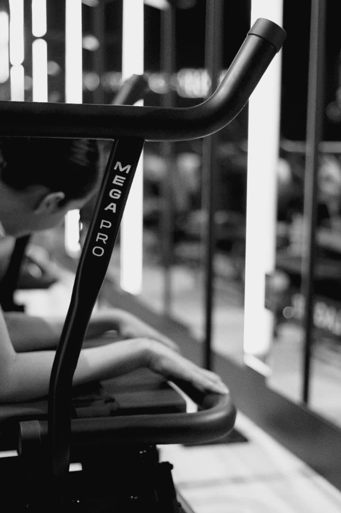 Mega Pro equipment in the Lagree Formation studio — black and white detail of the machine with vertical MEGA PRO branding.